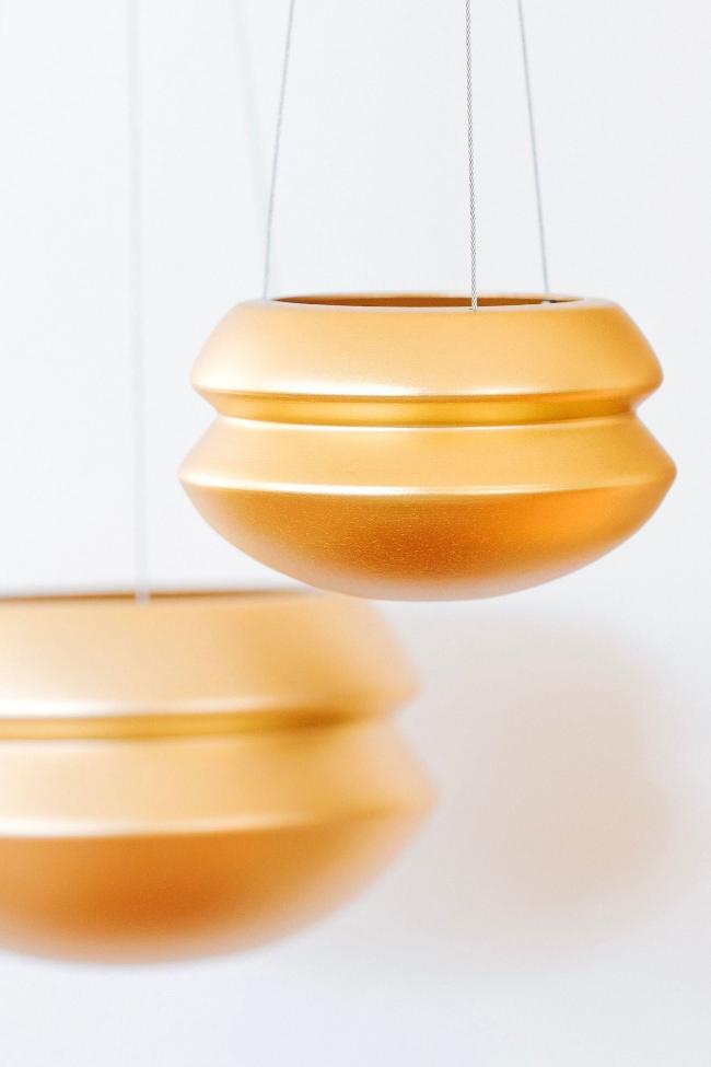 Medium and large brass halo for size comparison, the large is about 1.5 times the size of the medium. The medium is in the foreground and the large is in the background.